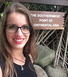 pretty girl smiling at the southernmost point of continental Asia
