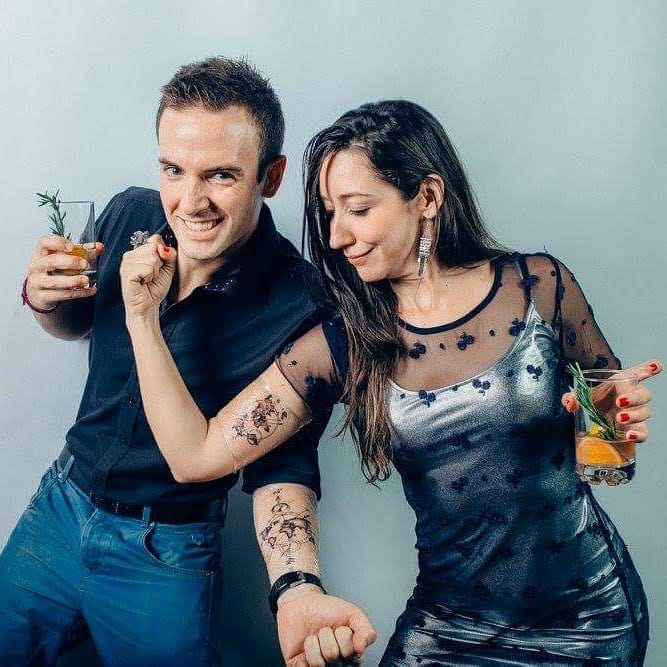 Simo and I posing our recently made twin tattoos on the arms
